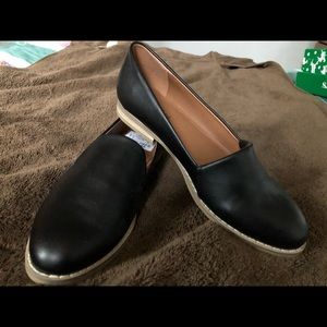 Navy blue leather flats.